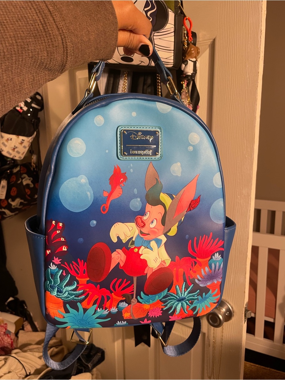 Loungefly Blue Pinocchio Underwater Mini Backpack with Red Coral Accents
